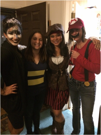 Picture of Jabeene, Ariana, Dr. Xu, and Sam at the Psychology Department's annual Halloween party